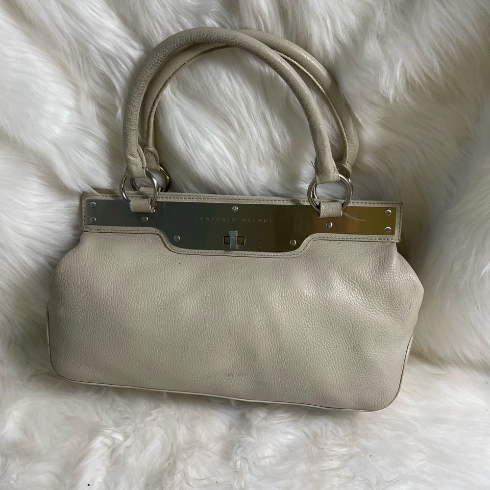 Antonio Melani light gray shoulder bag with silver tone accents and hard…
